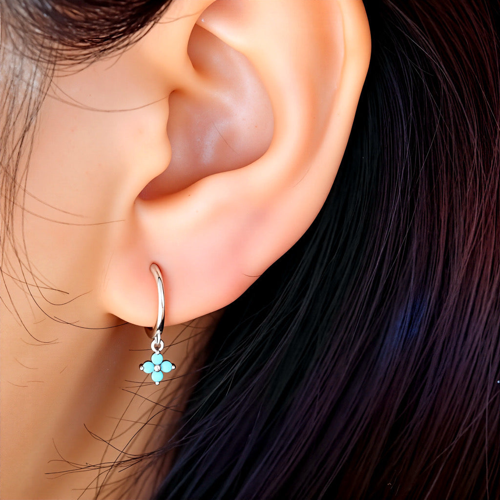 Model wearing PaulaB sterling silver rhodium hoop earrings with turquoise gemstone - Sydney jewellery Australia.
