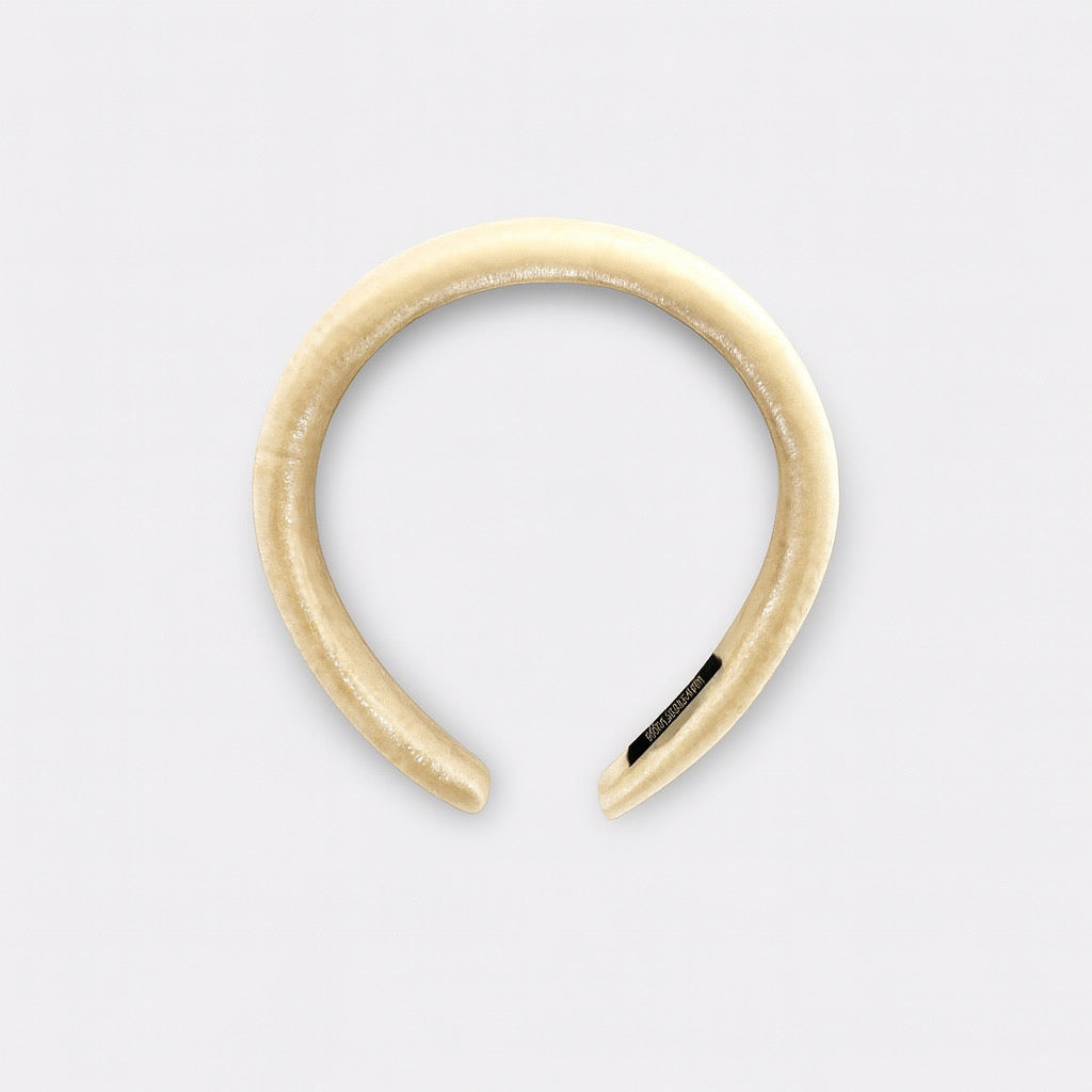 Cream velvet padded headband top view showing soft handmade design.