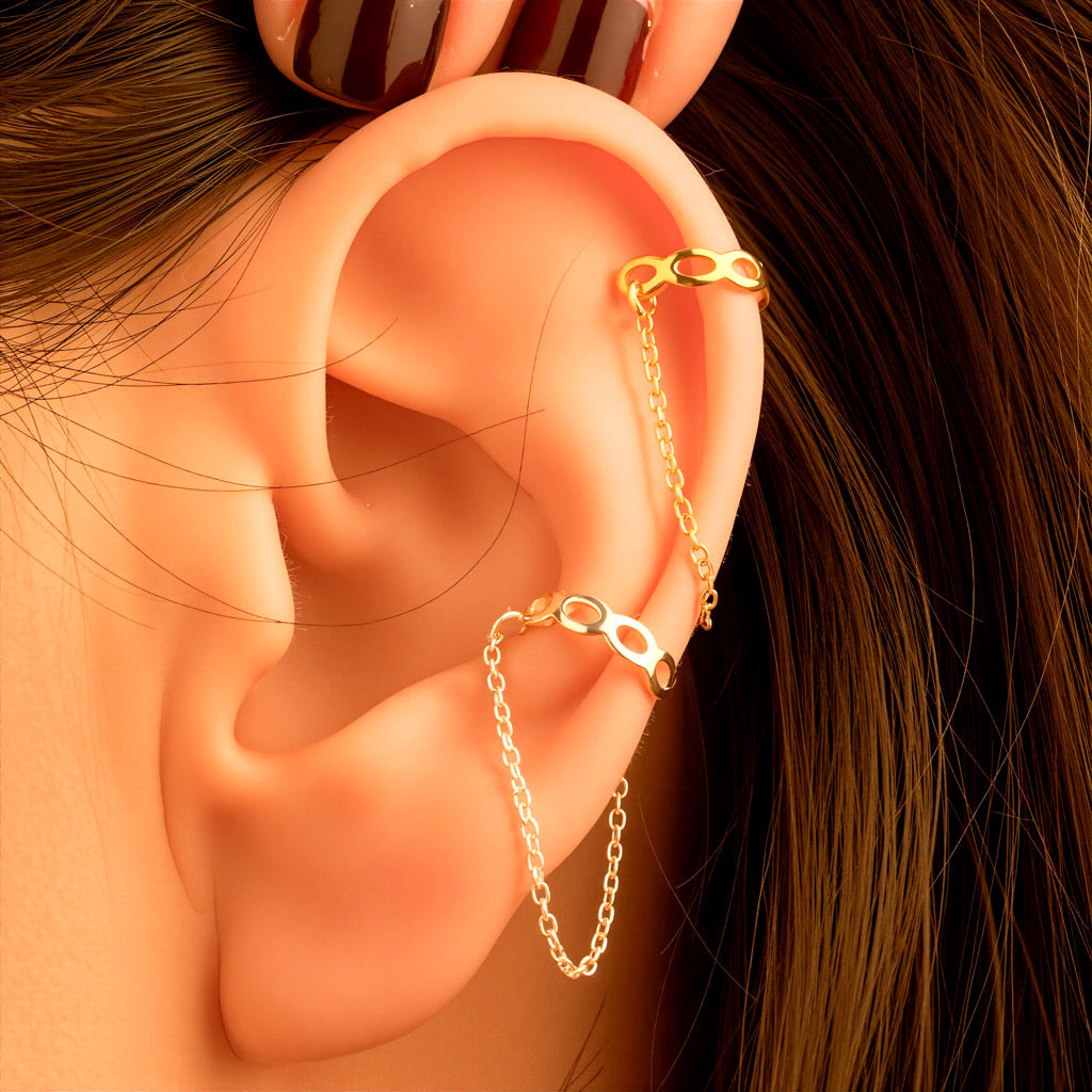 Fashion styling of Embrace Cuff Chain Earrings paired with other gold accessories