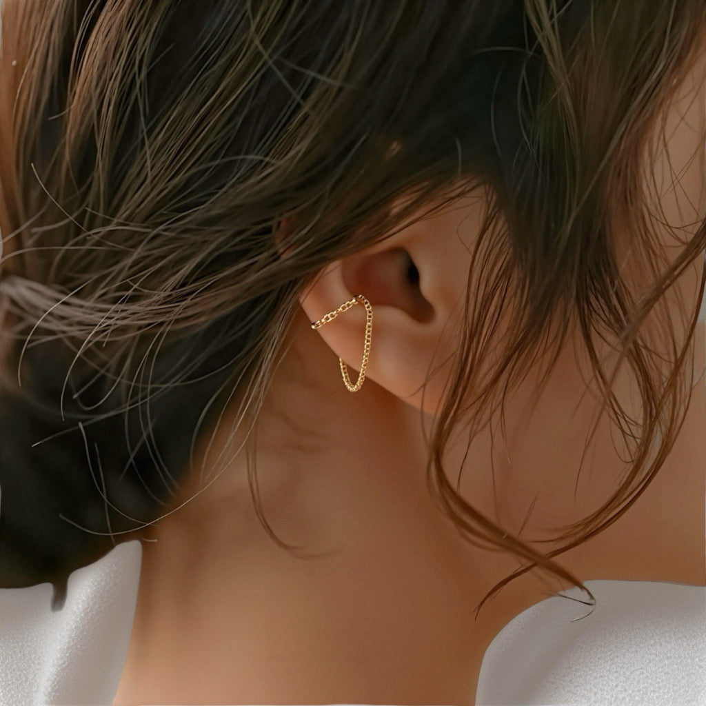 Model wearing Embrace Cuff Chain Earrings showing minimalist double cuff and chain detail 18k gold-plated sterling silver