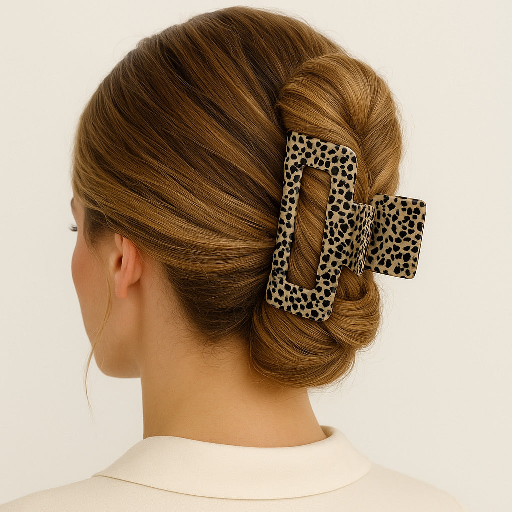 Blonde model with French twist wearing Ivory Eclipse animal print air claw clip.