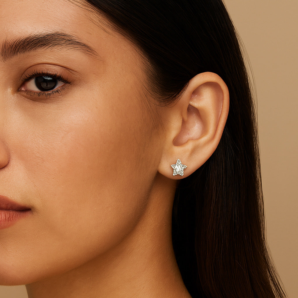 Elegant woman wearing sterling silver star stud earrings with white crystal stone- PaulaB Jewellery Sydney.