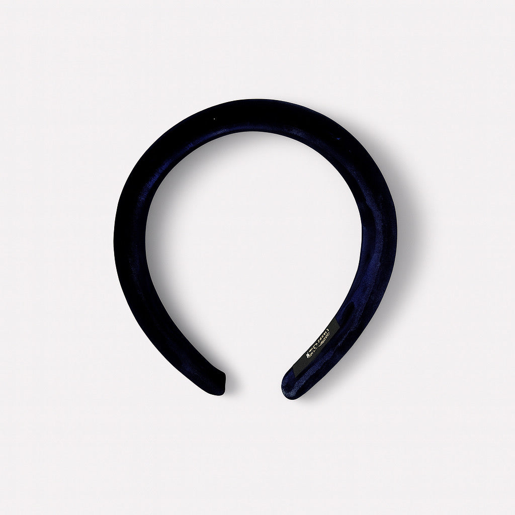 Top view of padded navy-blue velvet headband chic hair accessory.