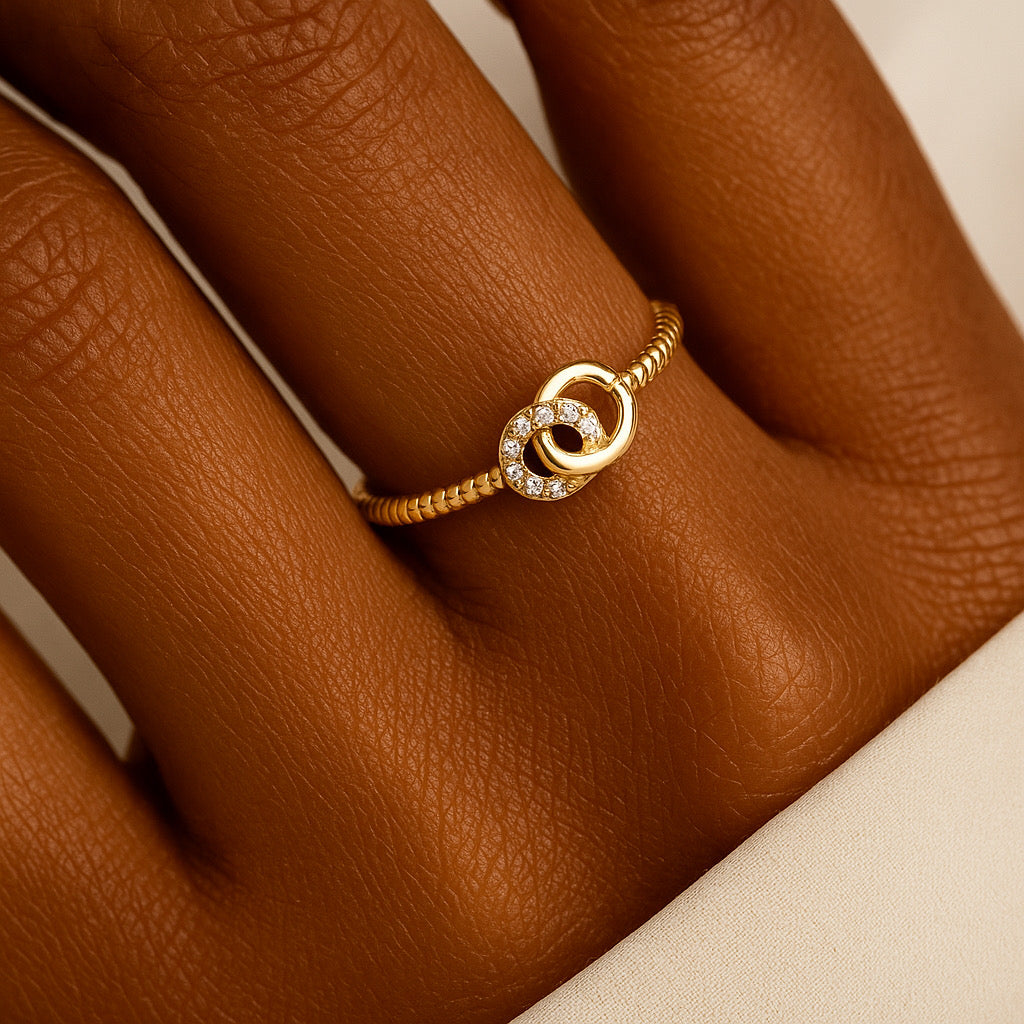 Model hand wearing PaulaB 14k gold plated sterling silver adjustable ring elegant style.