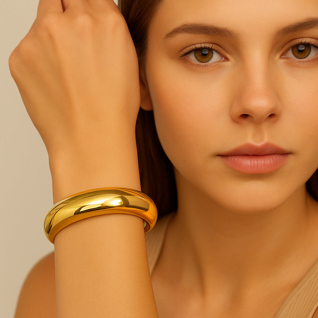 Pretty model wearing PaulaB 18k gold plated cuff bracelet - luxury minimal jewellery for everyday glamour.
