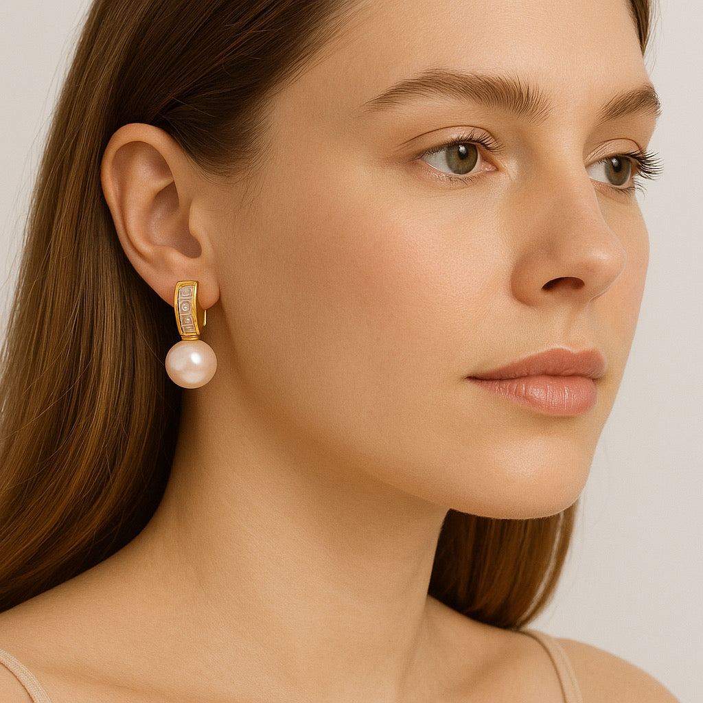 Model wearing 8k gold plated imitation pearl drop earrings with zirconia accents - PaulaB Jewellery Australia.