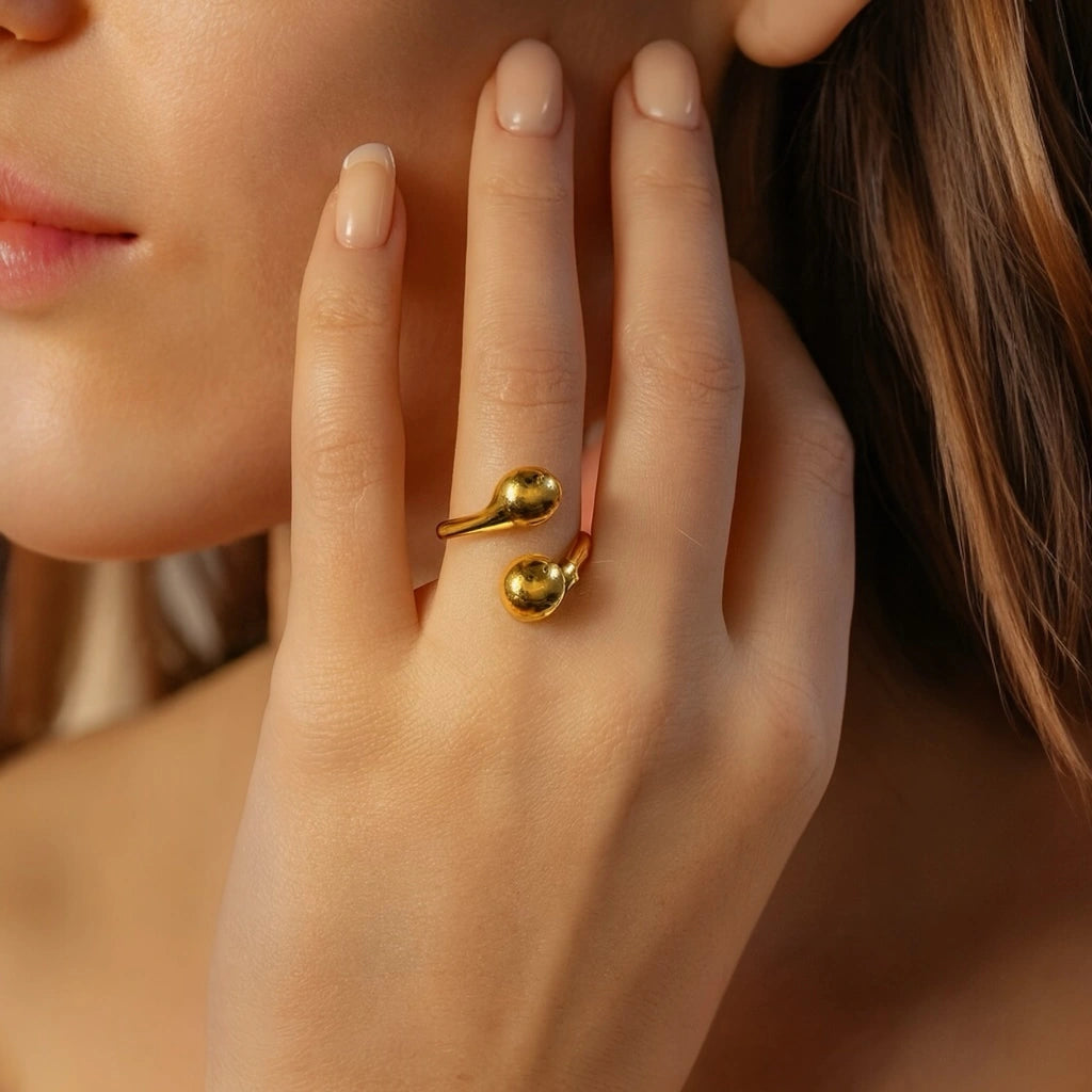 Model wearing PaulaB 18K Gold Teardrop Open Ring- elegant minimalist gold ring handcrafted from 316L stainless steel with polished finish. Designed in Sydney, Australia. 