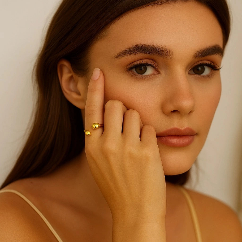 Model wearing PaulaB 18K Gold Teardrop Open Ring - soft warm beige tones, natural lighting, Australian designer jewellery brand PaulaB.