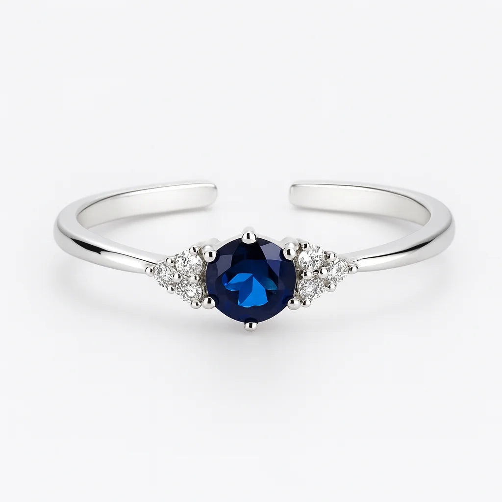 PaulaB adjustable S925 sterling silver ring with dark blue sapphire and cubic zirconia, rhodium plated finish. Studio hero shot for Australia, New Zealand and UK shoppers.