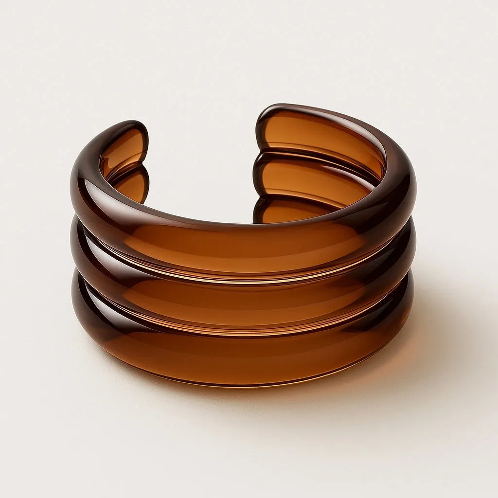 High-gloss amber resin cuff bracelet by PaulaB shown in clean studio angle for product details and online shopping, AU NZ UK.