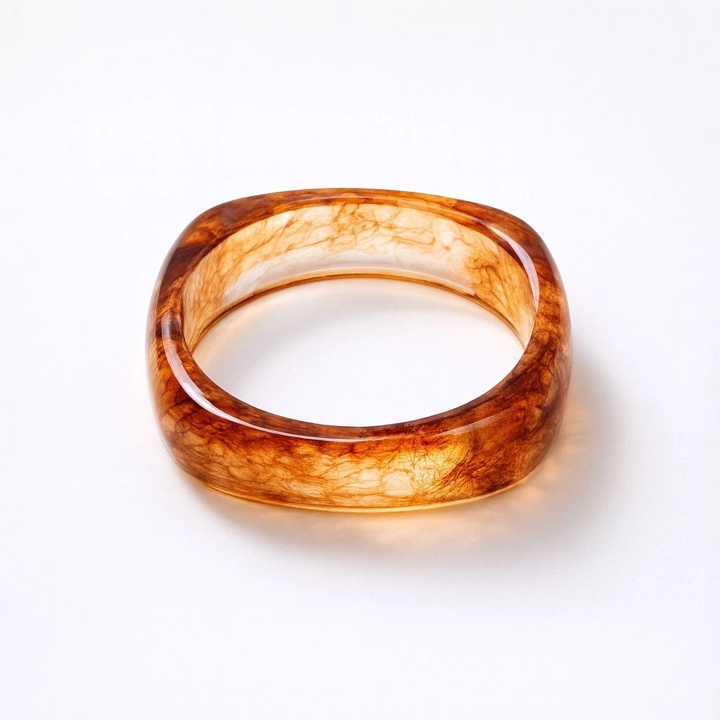 PaulaB amber resin square bangle - hero close-up on white background. Premium jewellery available in Australia, New Zealand and the UK.
