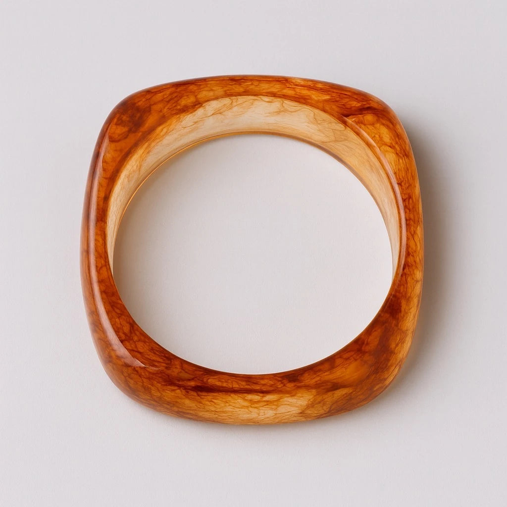 Top view of PaulaB amber resin square bangle showing marbled detail. Ships to Australia, NZ, UK.