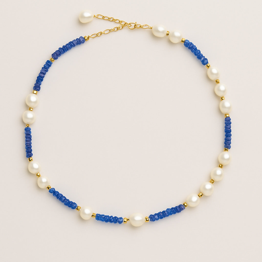 PaulaB necklace with natural blue stone beads, freshwater pearls, and 18k gold plating displayed laid flat on light background.     — PaulaB Jewellery Sydney AU
