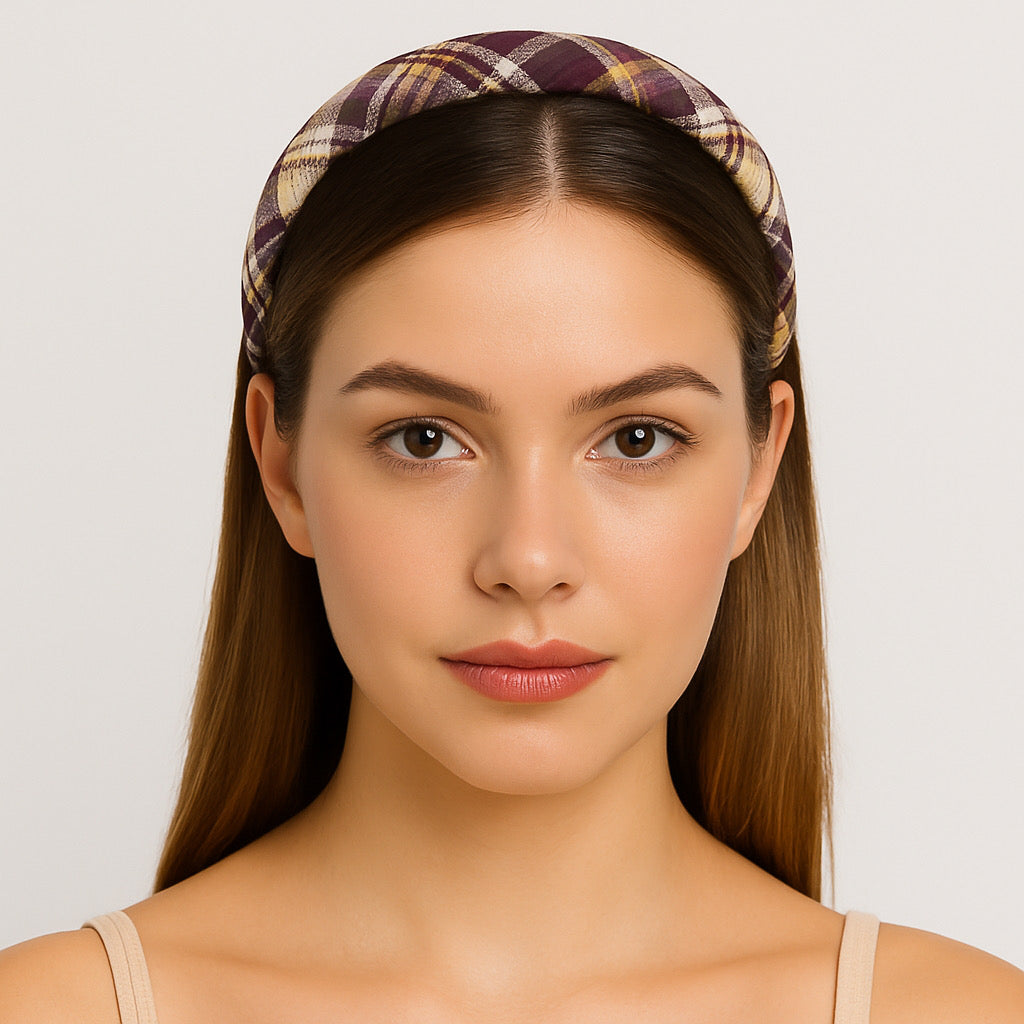 Model closeup wearing PaulaB burgundy plaid headband, elegant accessory