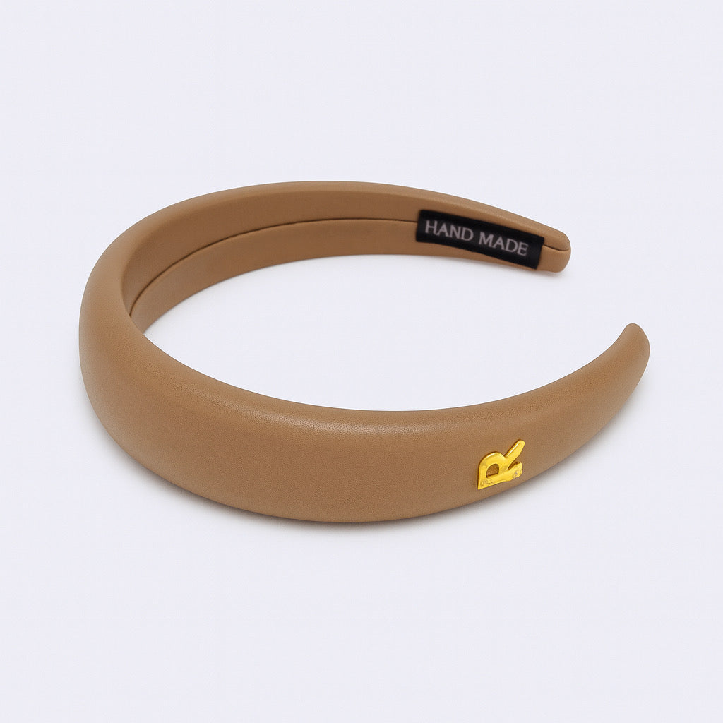 PaulaB PU leather padded headband in camel beige flat lay handmade accessory.