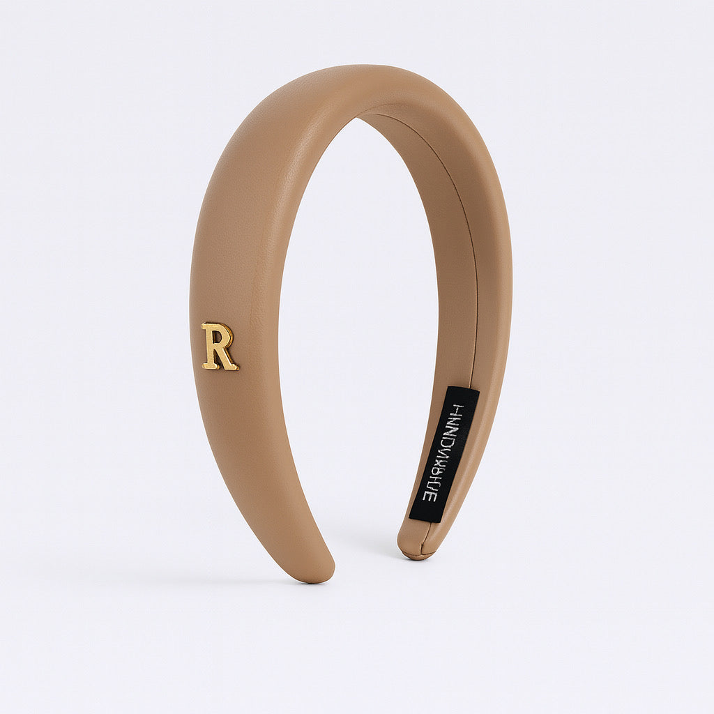 PaulaB camel beige PU leather padded headband front display on white background. 