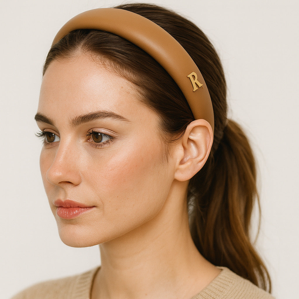 PaulaB champagne beige PU leather padded headband worn by model chic side profile.