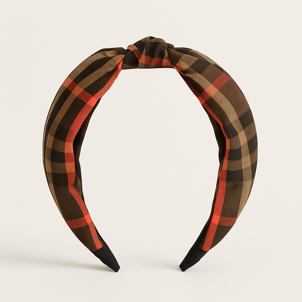 Silk-touch polyester plaid headband in standing upright display with knot detail.