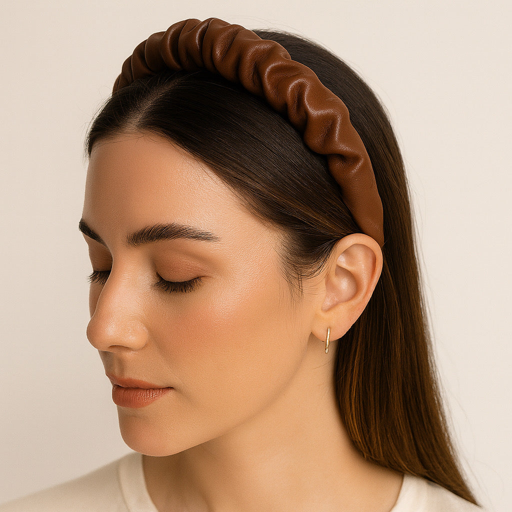 PaulaB Chocolate Brown elegance leather ruched headband styled on a model in side profile, soft indoor light.
