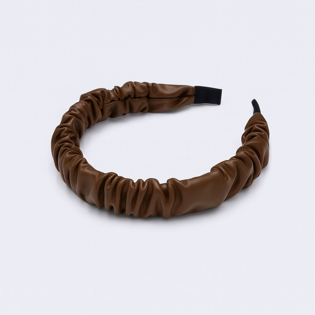 PaulaB Chocolate Brown PU leather ruched headband flat lay view on light background.
