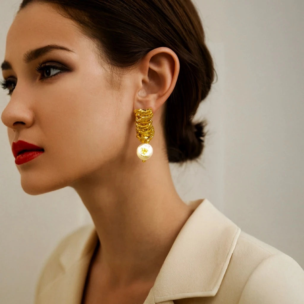 Close-up of PaulaB Eclat de Perle Earrings luxury gold plated sculptural drops with pearls. PaulaB Jewellery Australia NZ UK.