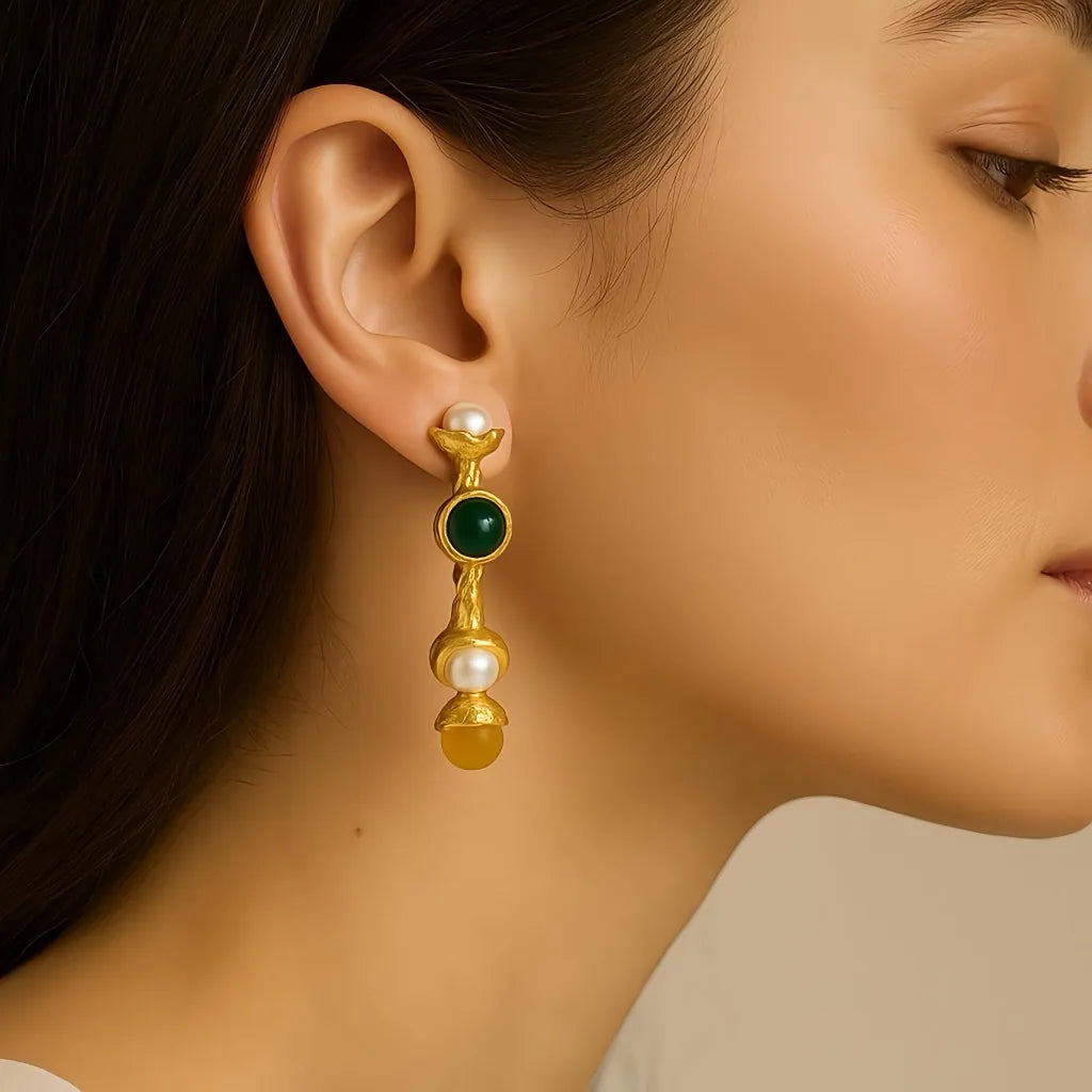 Closeup side view of PaulaB gold hoop earrings with pearls and vibrant gemstones. Premium accessory for style lovers in Australia, New Zealand and United Kingdom.  
