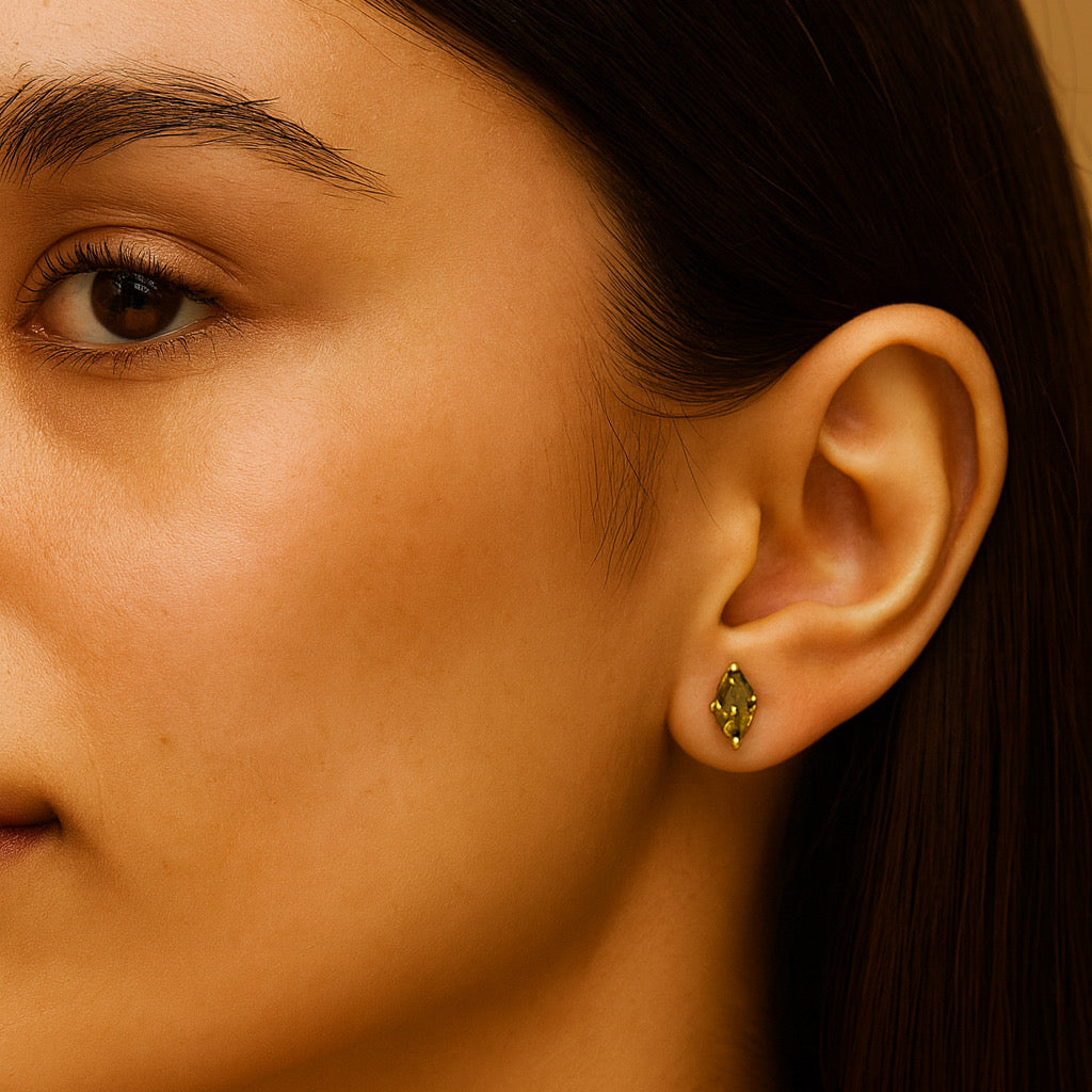 Model wearing PaulaB sterling silver & 14k gold plated emerald cubic stud earrings - Sydney jewellery.