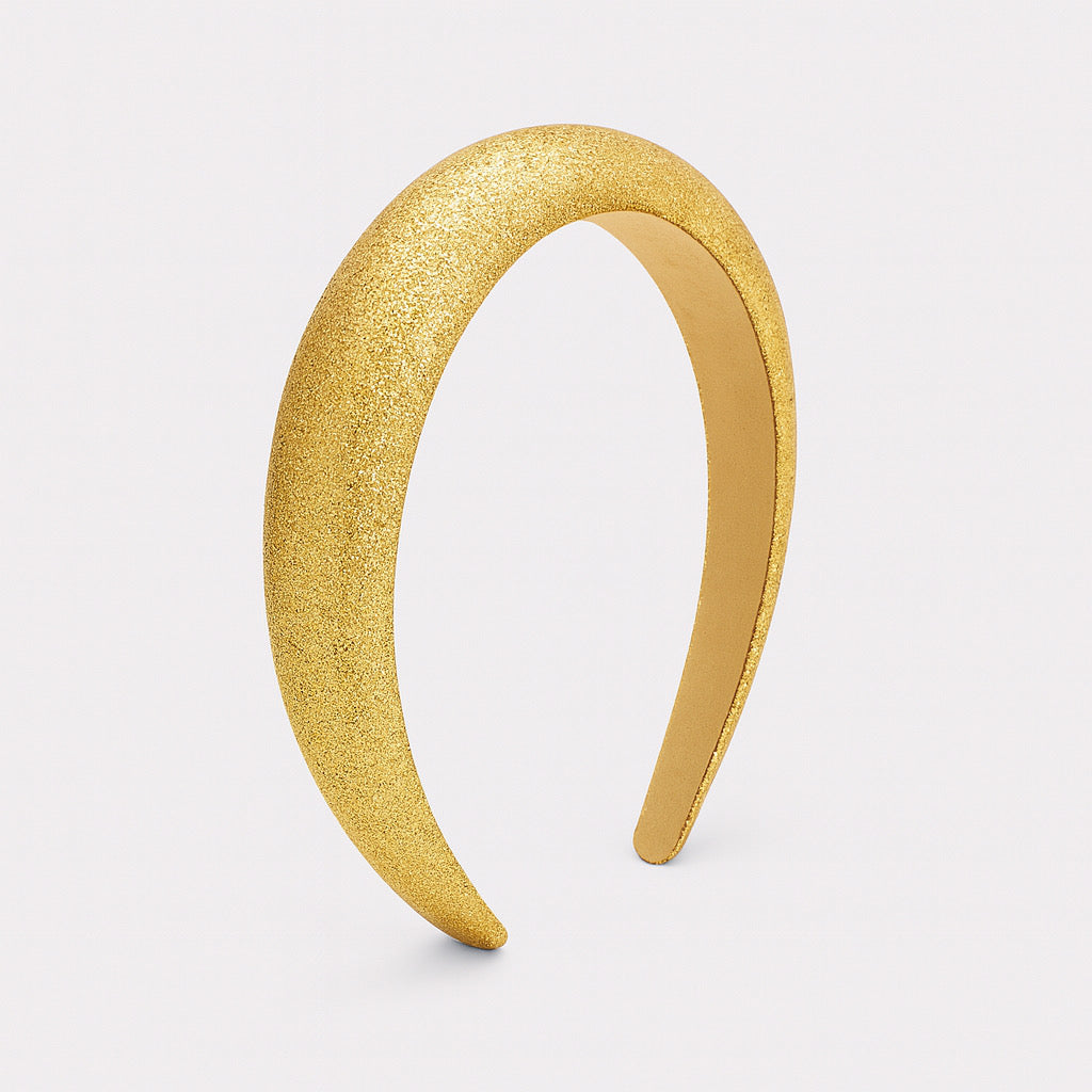 PaulaB gold glitter padded headband side profile view, chic women's fashion accesory.
