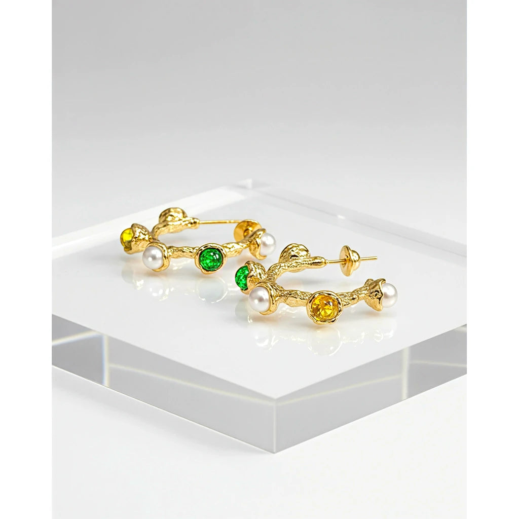 PaulaB 18k gold plated hoop earrings with green gemstones, yellow crystals and pearls displayed on clear stand. Premium fashion jewellery for Australia, New Zealand and the UK.