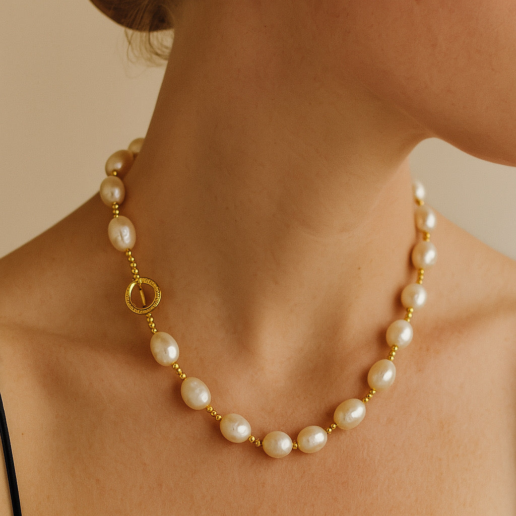 Side view of PaulaB Golden Pearl Elegance Necklace showing toggle clasp and freshwater pearls.