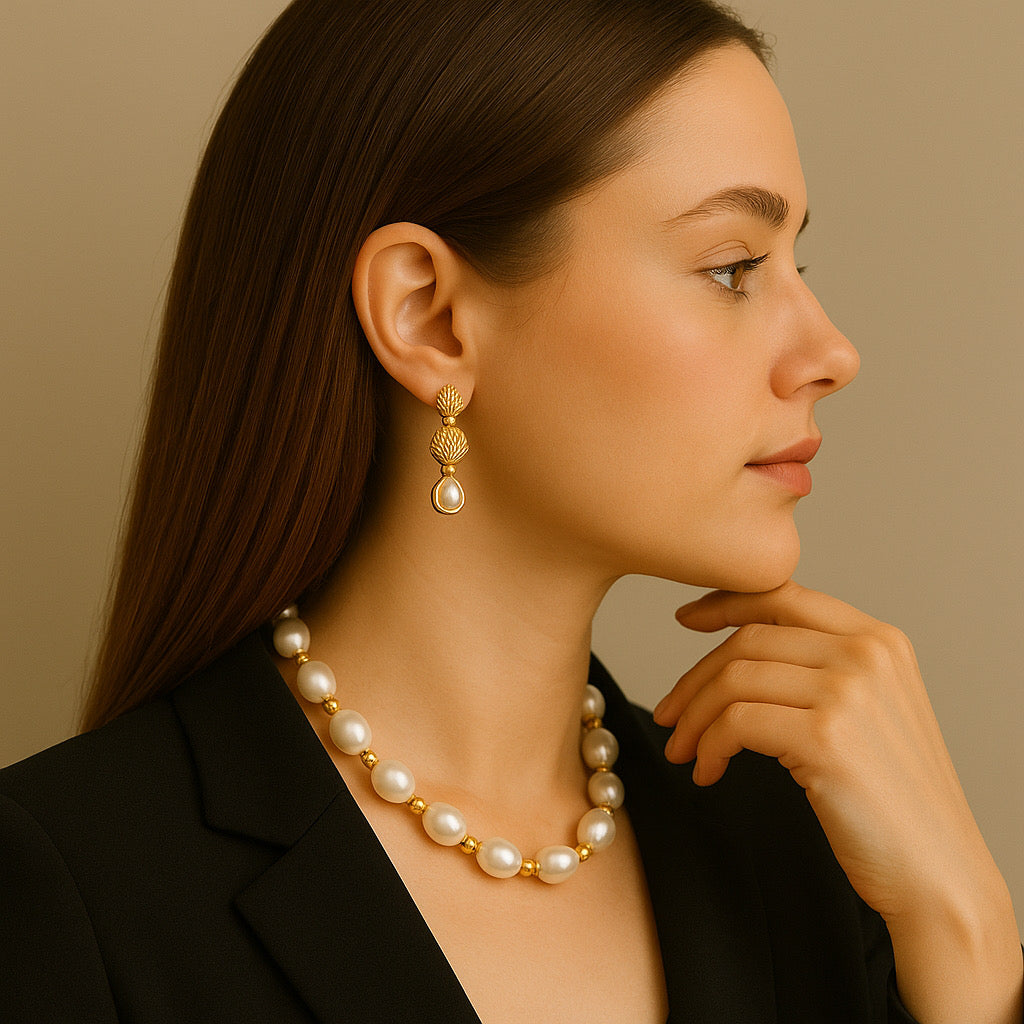 PaulaB Golden Pearl Elegance Necklace styled with gold earrings on model, elegant look.