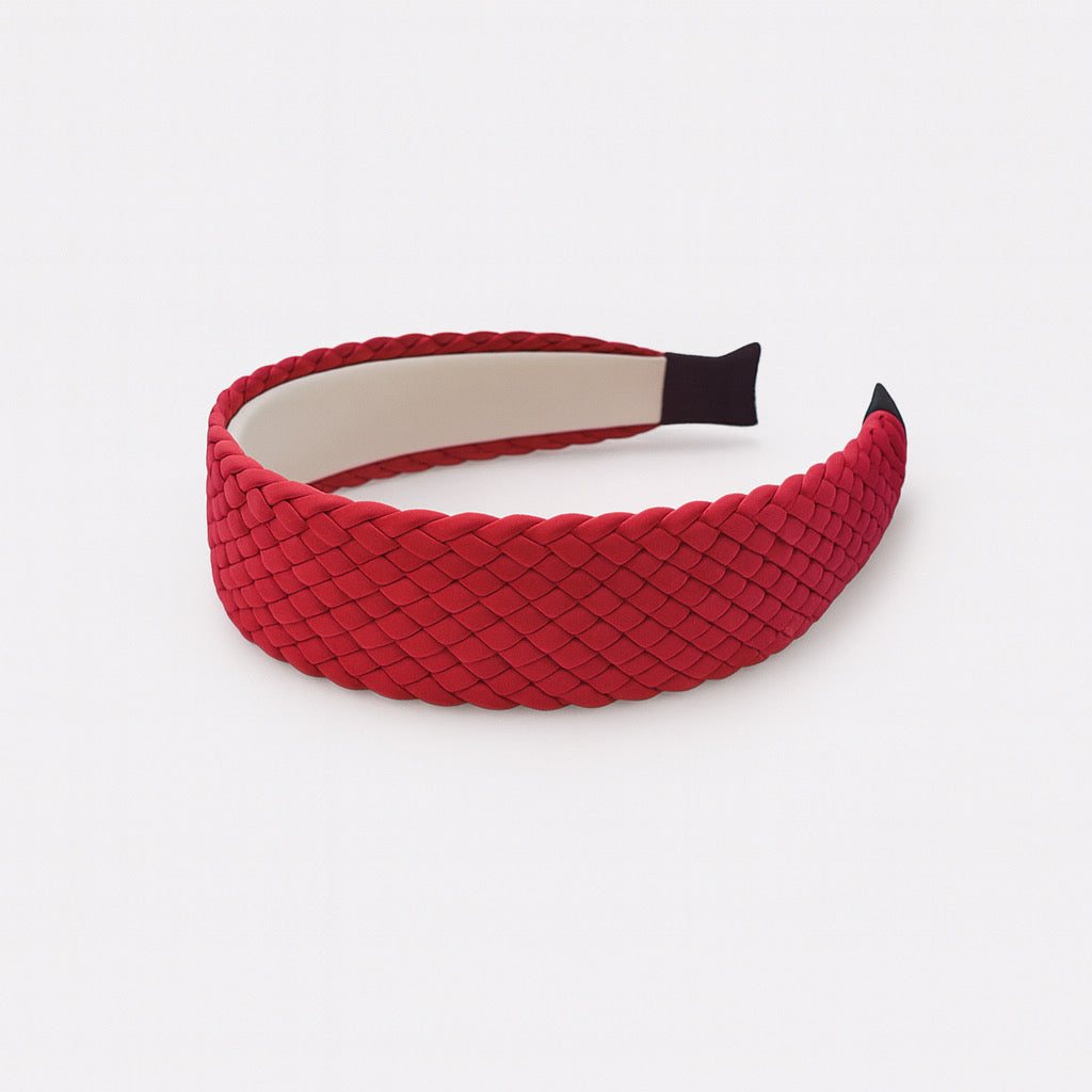 Hot red PU leather braided headband displayed flat woven women's fashion accessory.