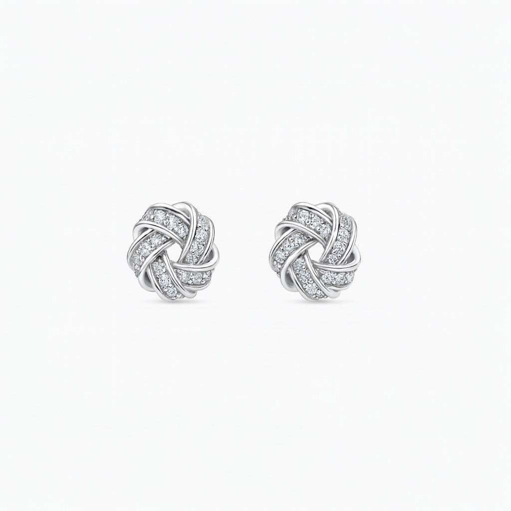 PaulaB love-knot zircon stud earrings in rhodium-plated sterling silver, front view, 1cm.