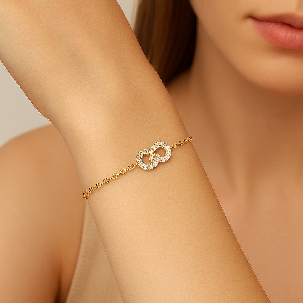 Pretty model wearing PaulaB Eternal Link Bracelet- 14k gold plated 925 sterling silver dainty jewellery.