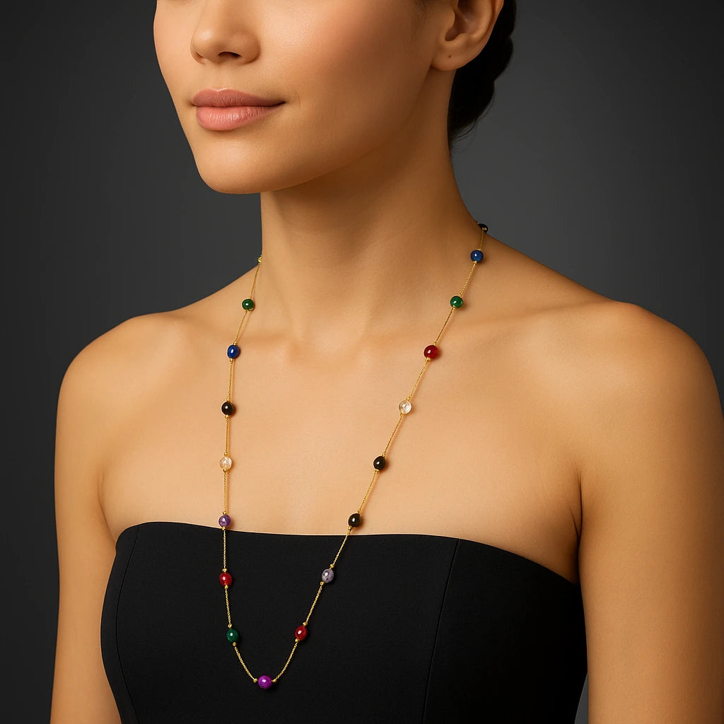 PaulaB multicolor gemstone necklace with gold finish modern luxury jewellery photo in black studio backdrop. 