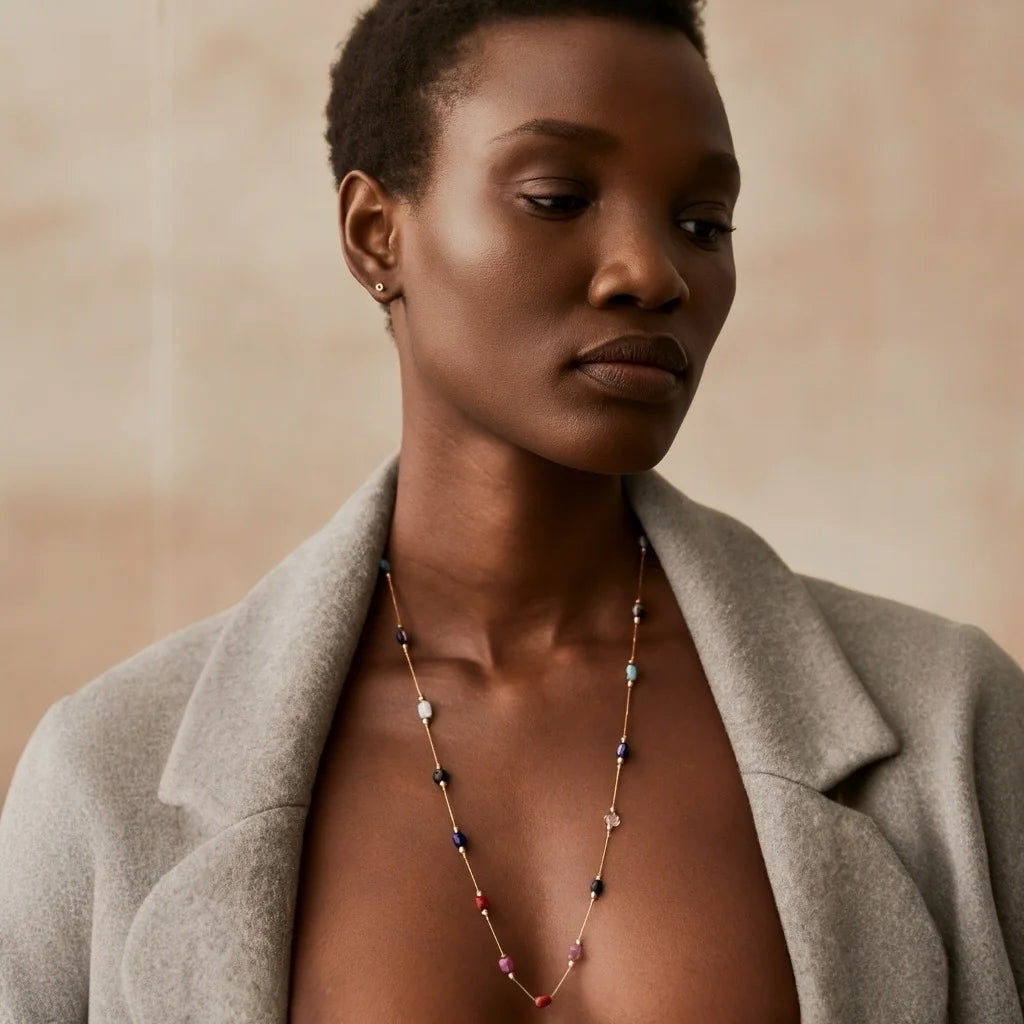 PaulaB gold-plated multicolor necklace worn with grey blazer editorial fashion jewellery photo Australia.