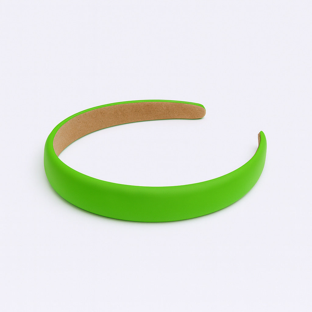 PaulaB neon green PU leather headband flat lay on neutral background