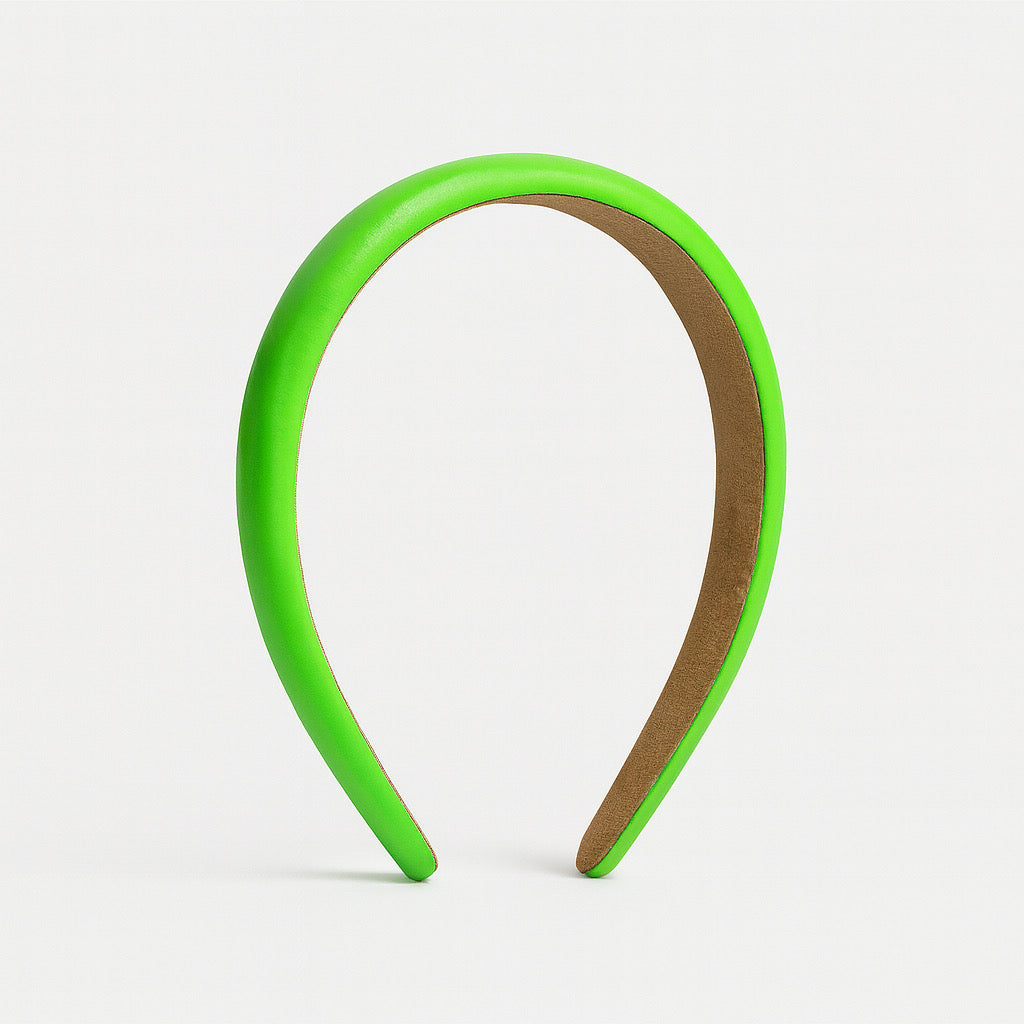 PaulaB neon green PU leather headband in upright standing display 