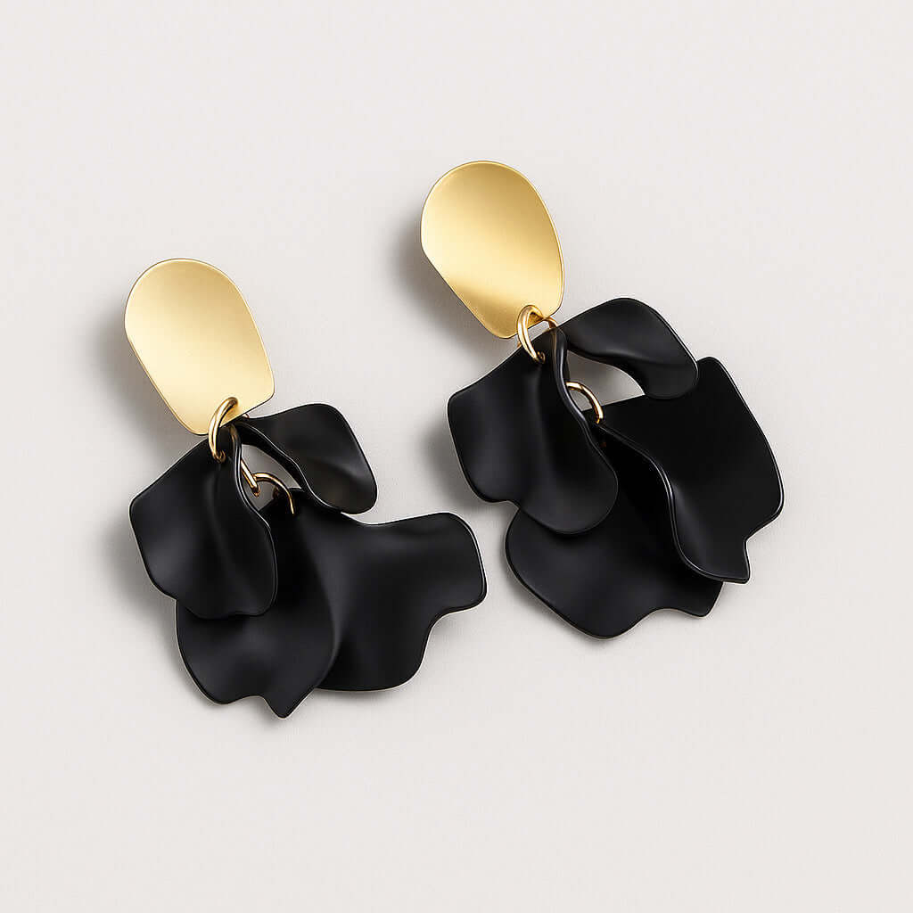 Black petal statement earrings angled view.
