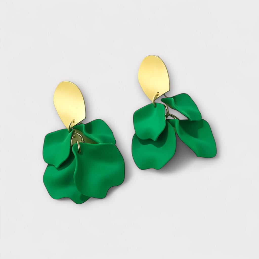 Emerald green petal statement earrings angled view.
