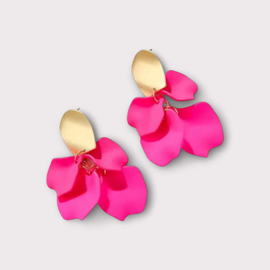 Hot pink petal statement earrings angled view.