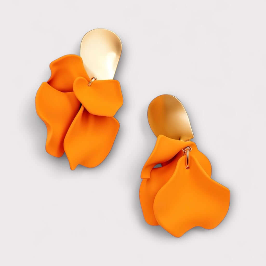 Orange petal statement earrings angled view.
