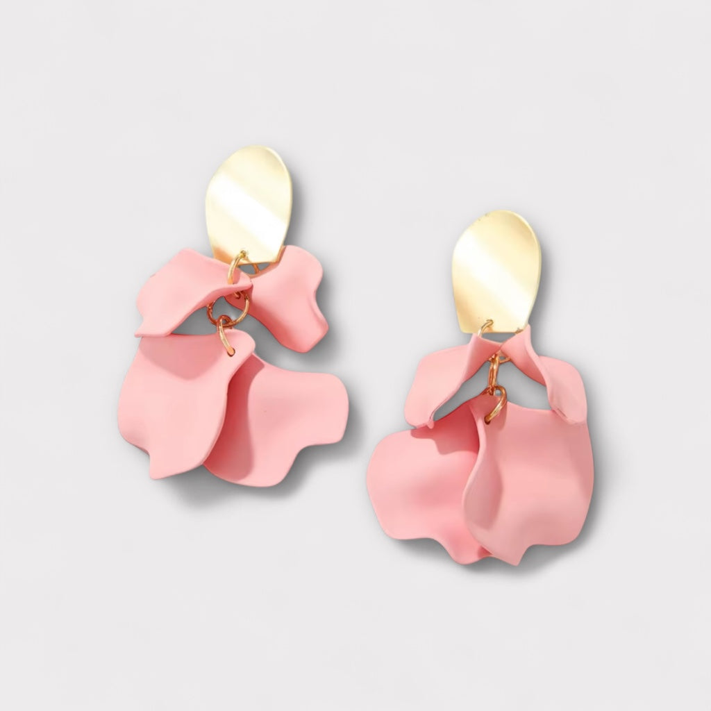 Soft pink petal statement earrings front view.
