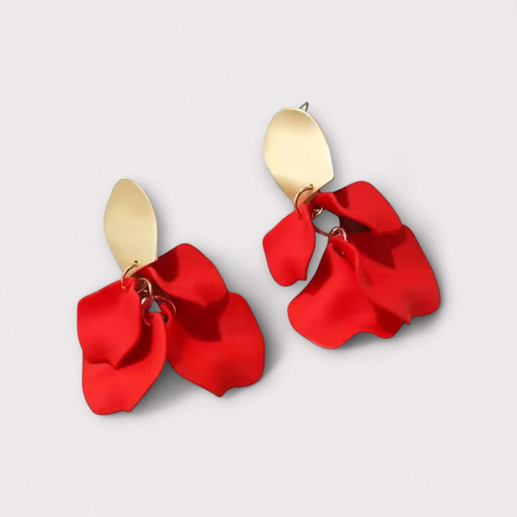 Scarlet red petal statement earrings angled view.
