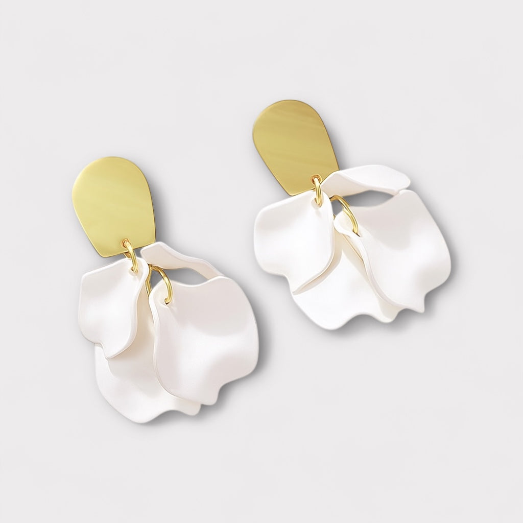 White petal statement earrings front view.
