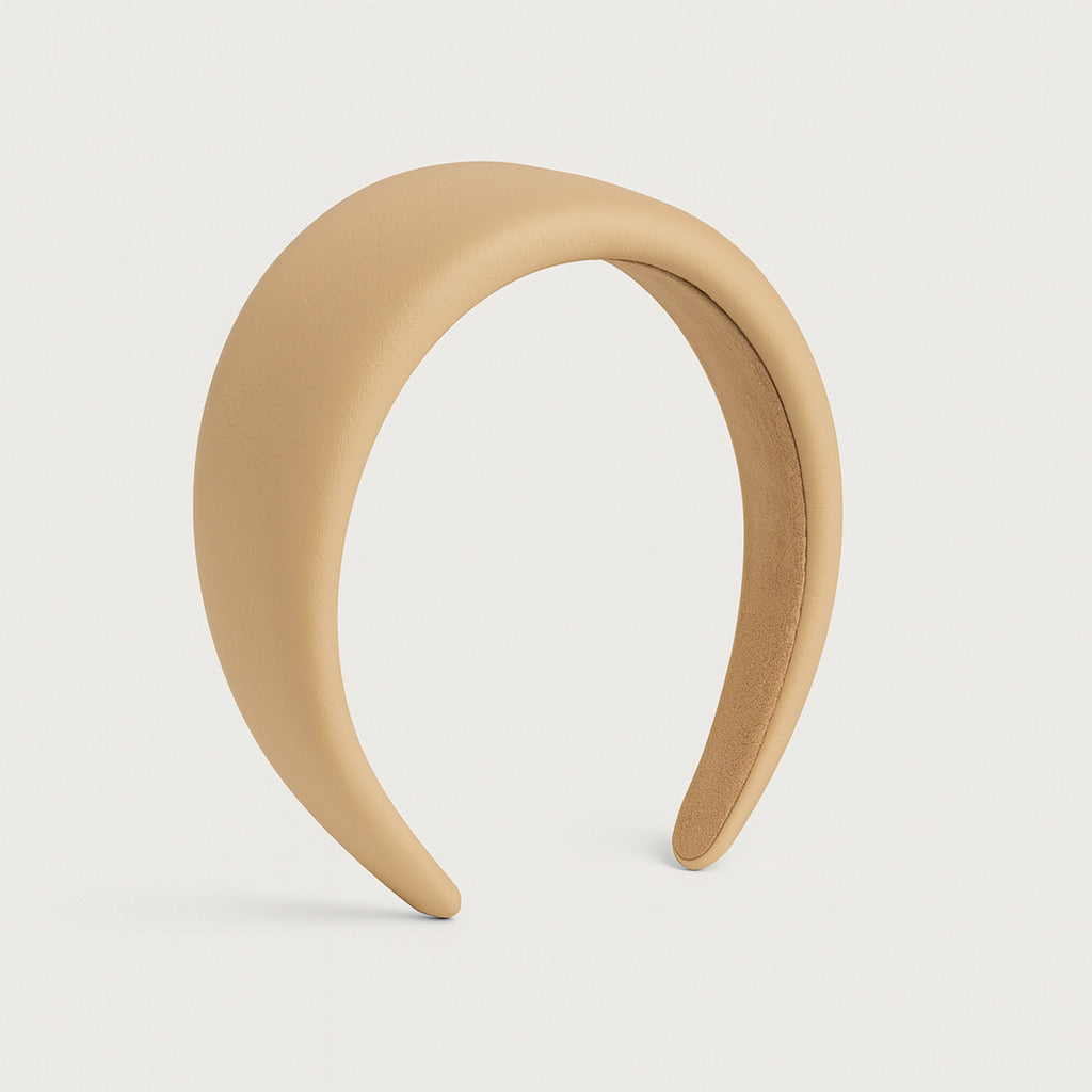 Side angle of PaulaB vegan PU leather padded headband in nude beige, 4cm wide design.