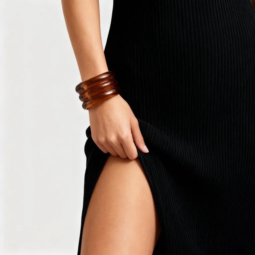 PaulaB brown, amber resin cuff bracelet styled with black dress for chic evening or event fashion inspiration. AU, NZ & UK.