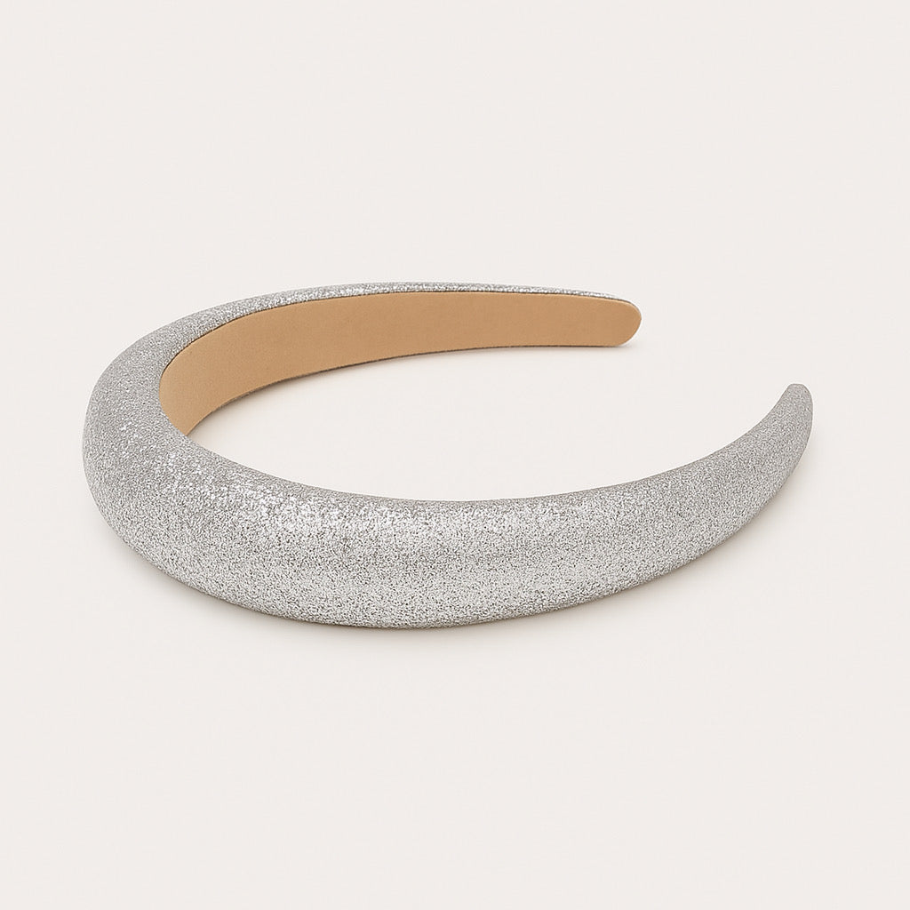 Lay flat view of silver glitter padded crown headband, PaulaB.
