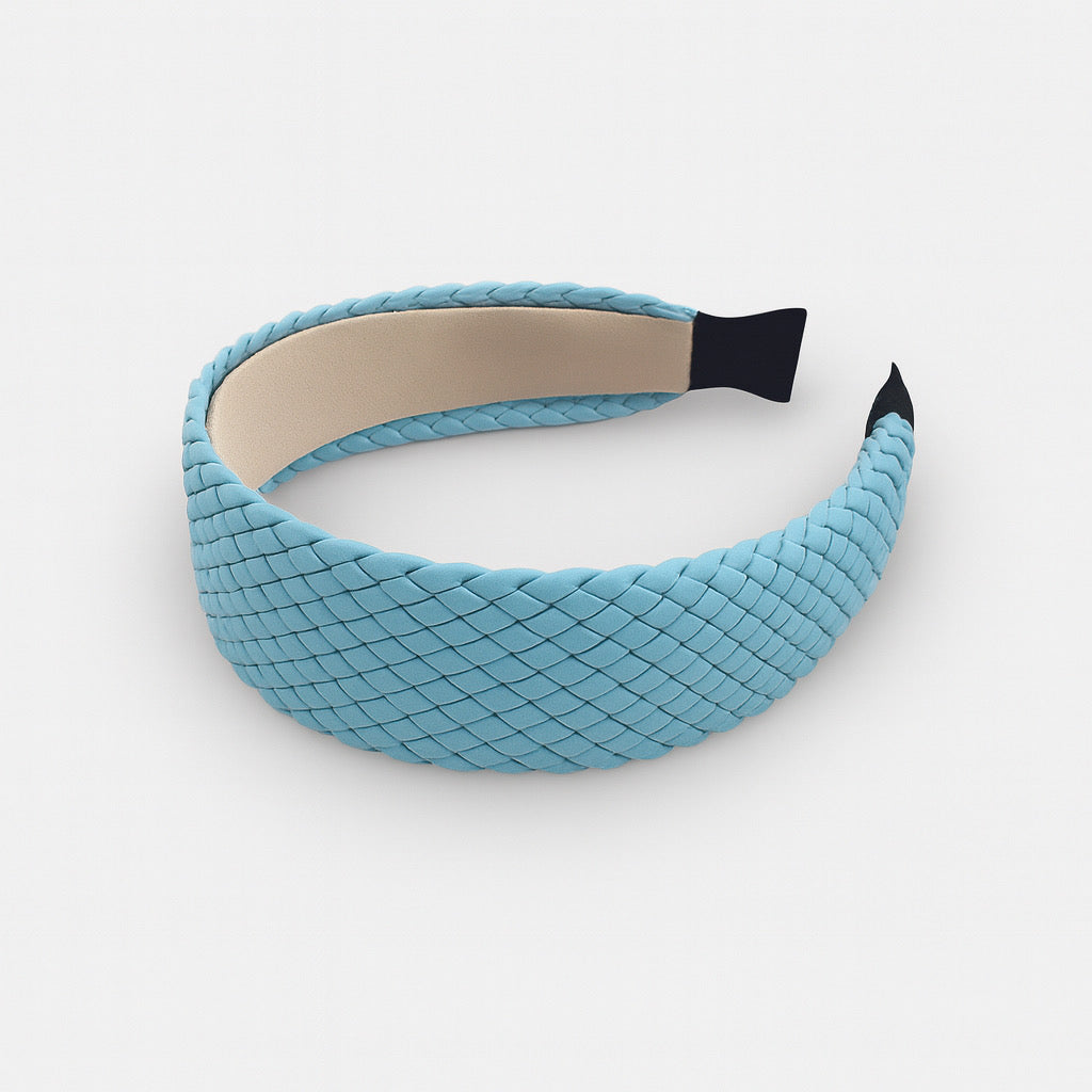 Sky blue woven PU leather headband displayed flat chic women's hair accessory.