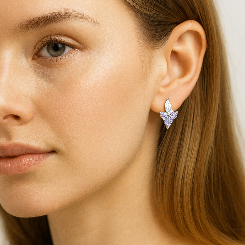 Model wearing PaulaB sterling silver earrings with purple gemstones - Sydney fashion accessories.
